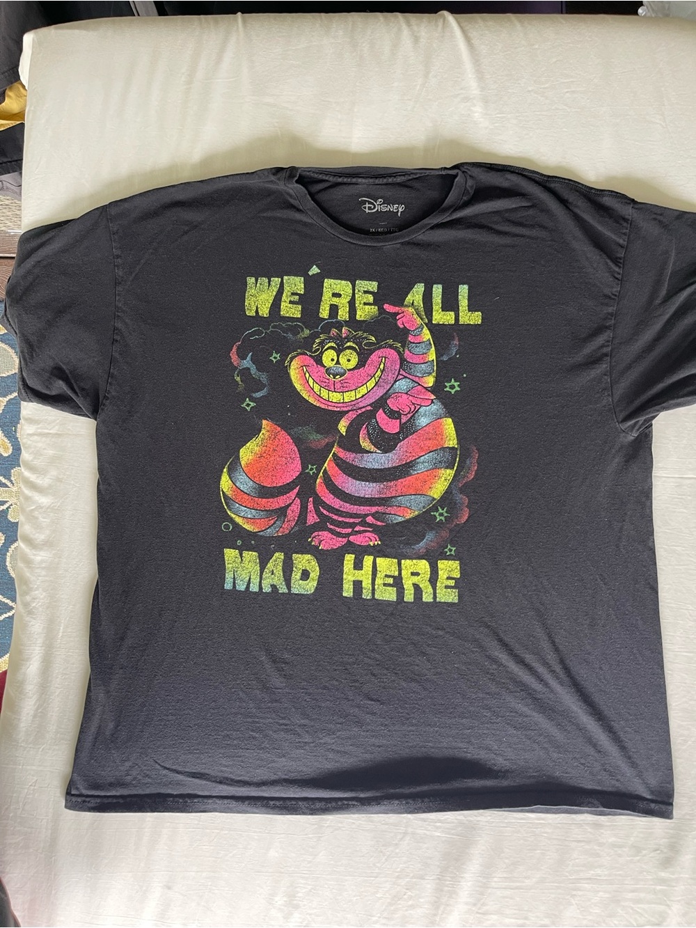 Disney Black Tee with Neon Cheshire Cat 'We're All Mad Here' Graphic